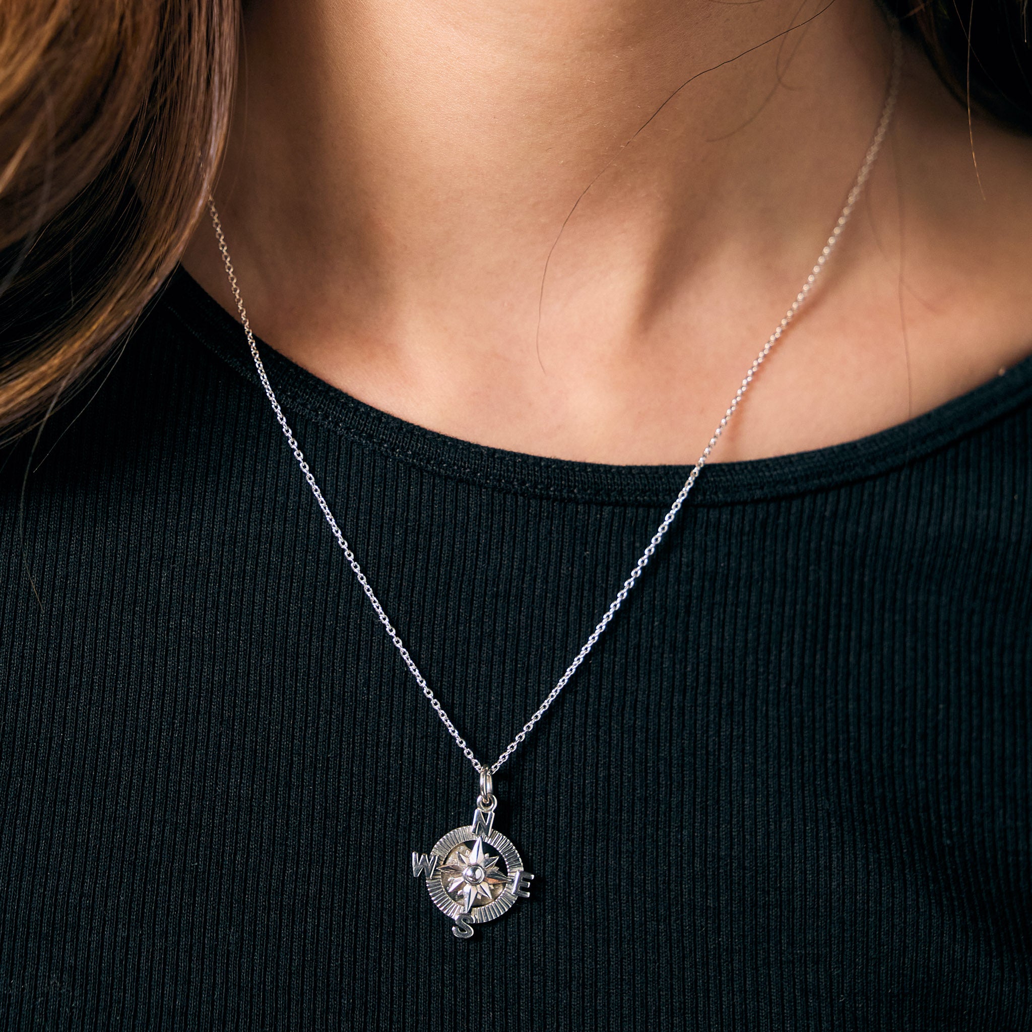 Compass Necklace worn by a woman