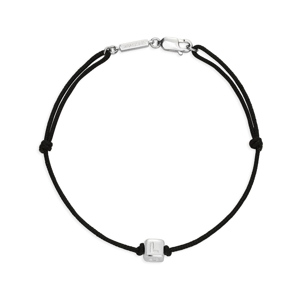 Black cord bracelet with silver clasp and square charm showing the letter L of Love.