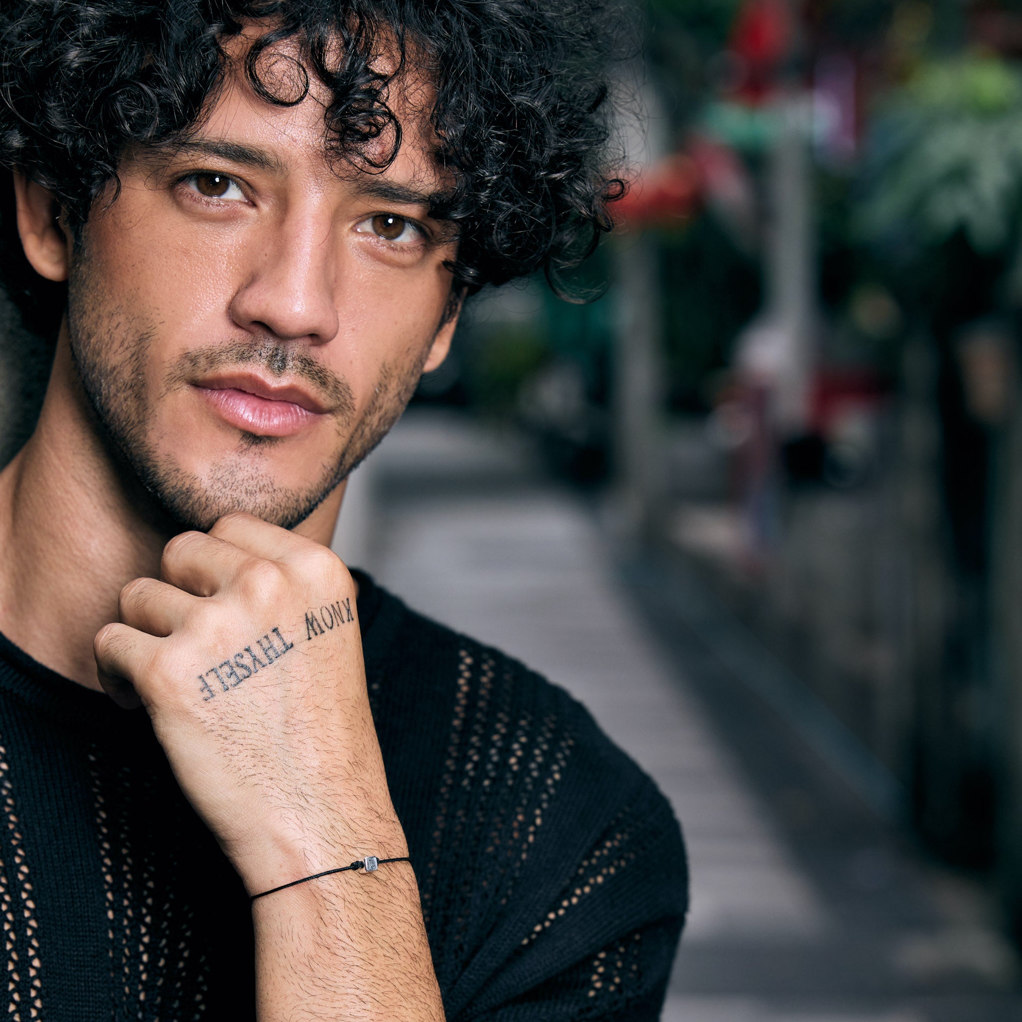 Male Model wearing a silver love charm