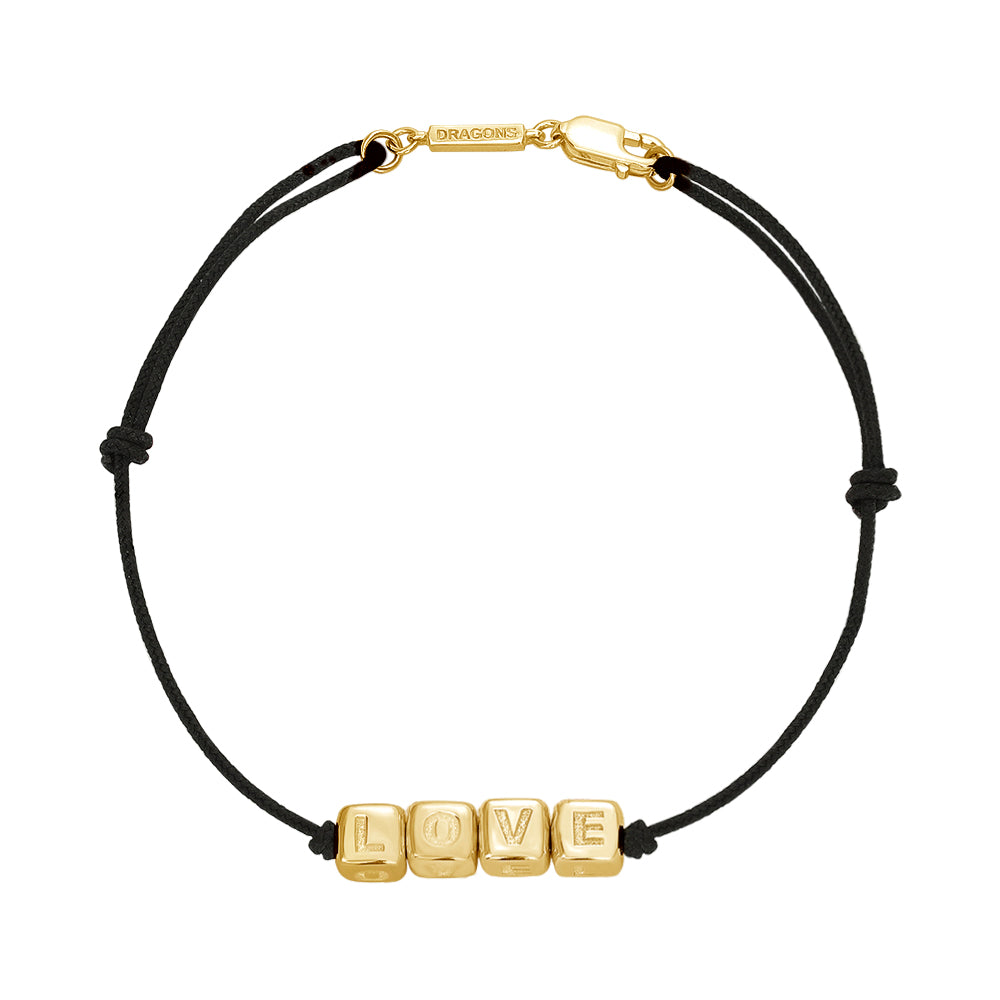 Black cord bracelet with charms made of gold 'LOVE' cubes 