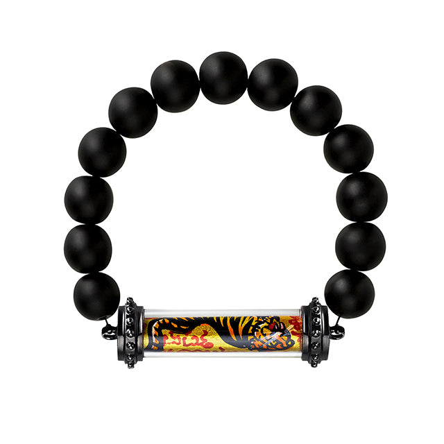 Onyx beaded bracelet with a thai amulet featuring a hand painted tiger. 